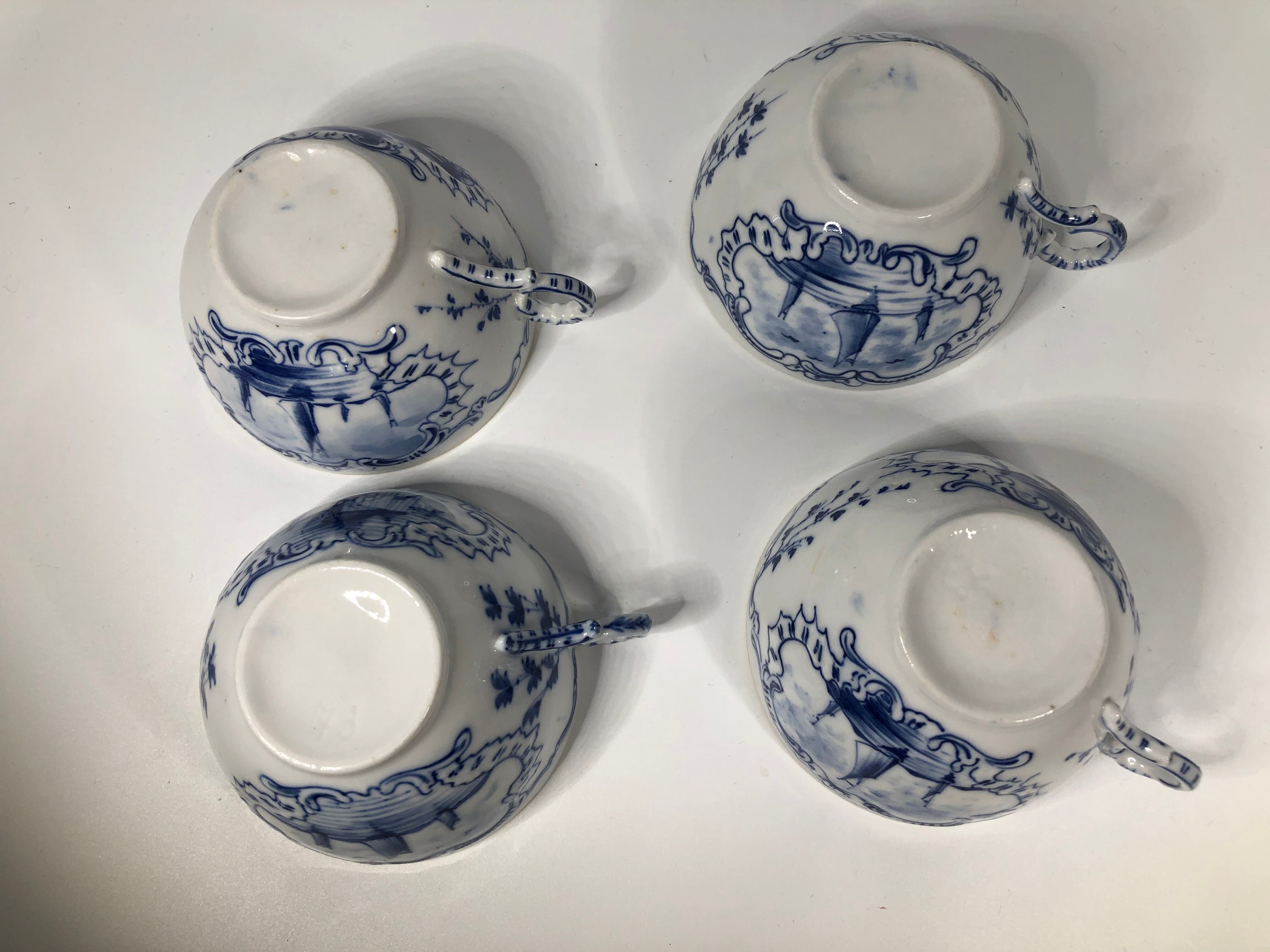 4 old cups and under Rauenstein Delft cups