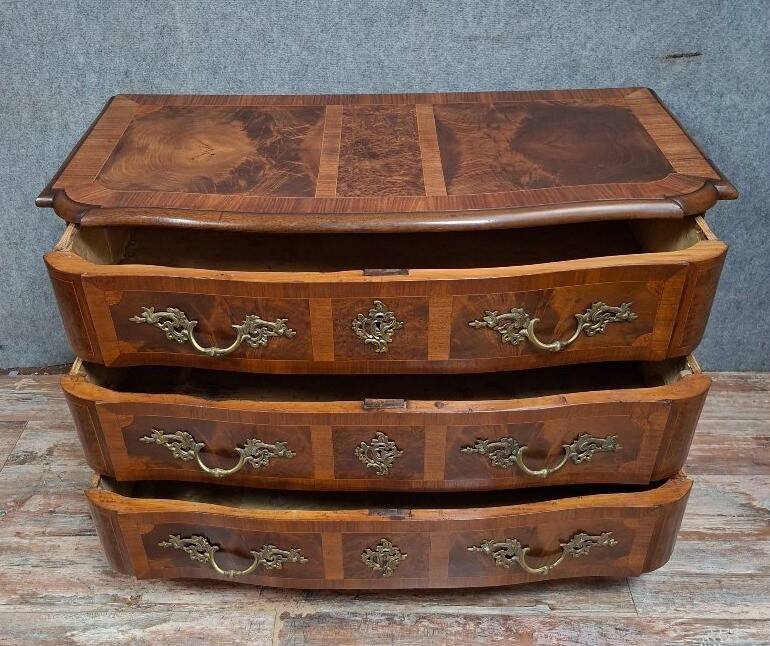 Curved commode from the Louis XIV period in marquetry - adorned with gilded bronze fittings.