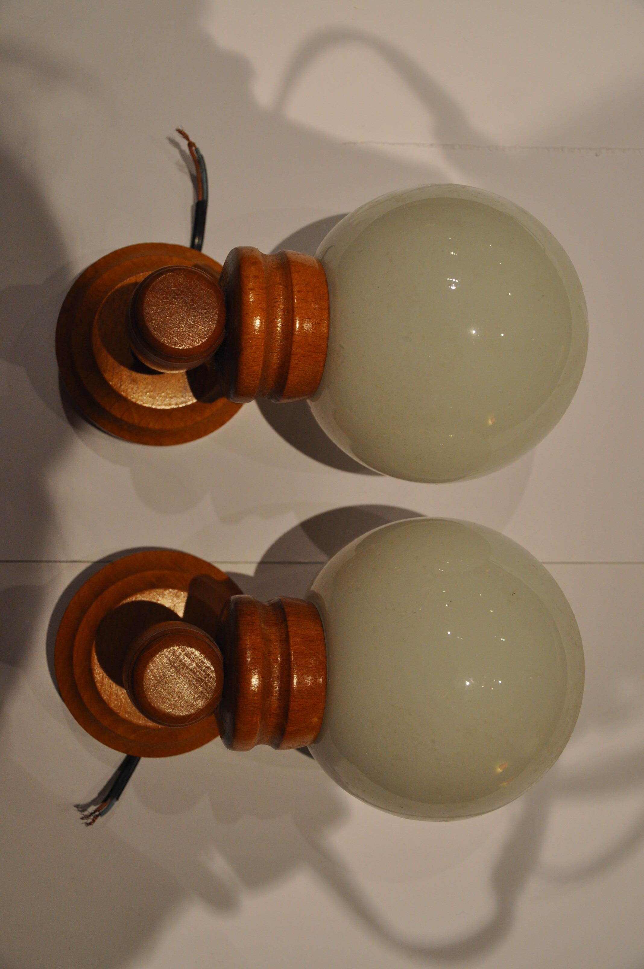 Duo of wooden wall light and glass globes