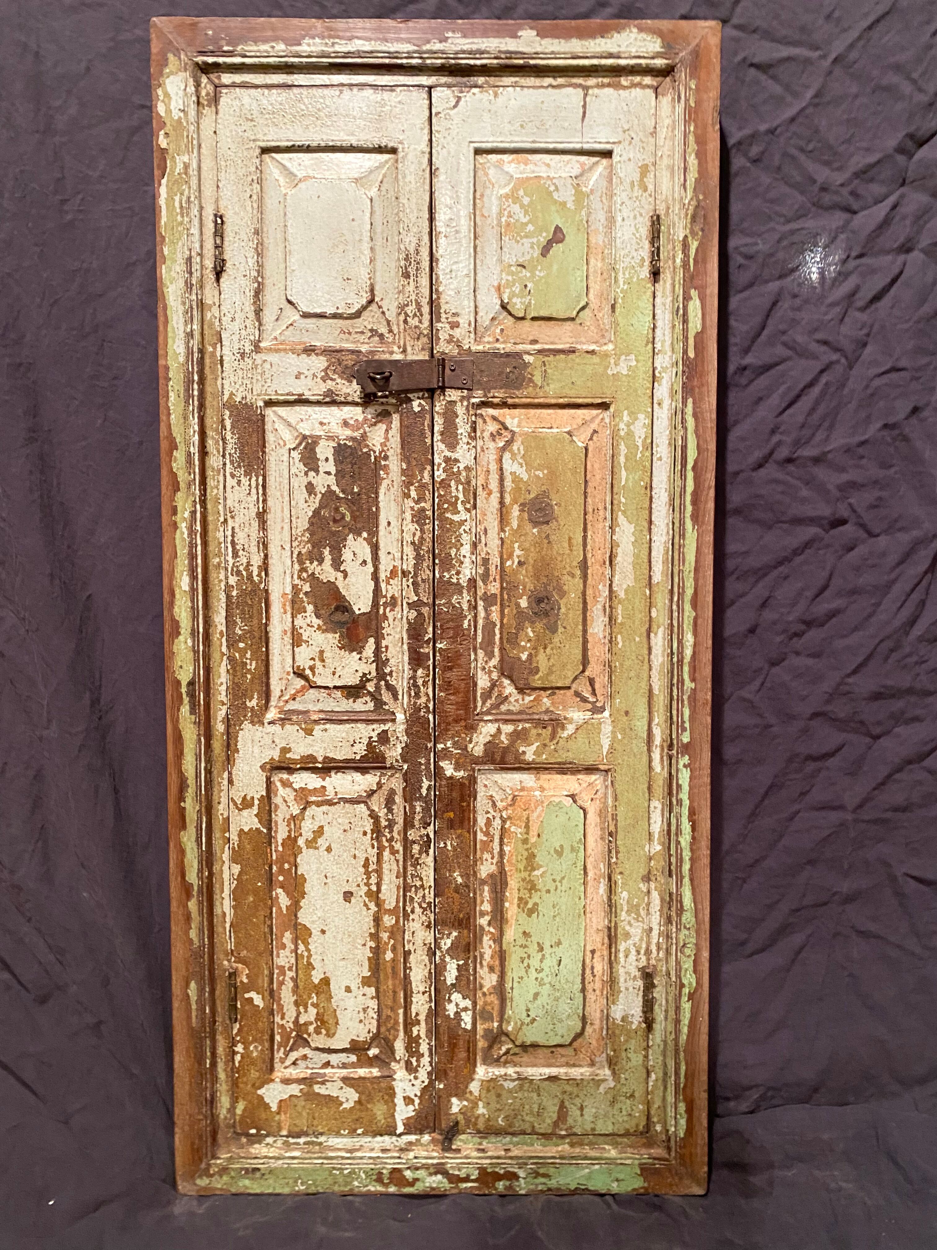 Indian window in green patinated wood