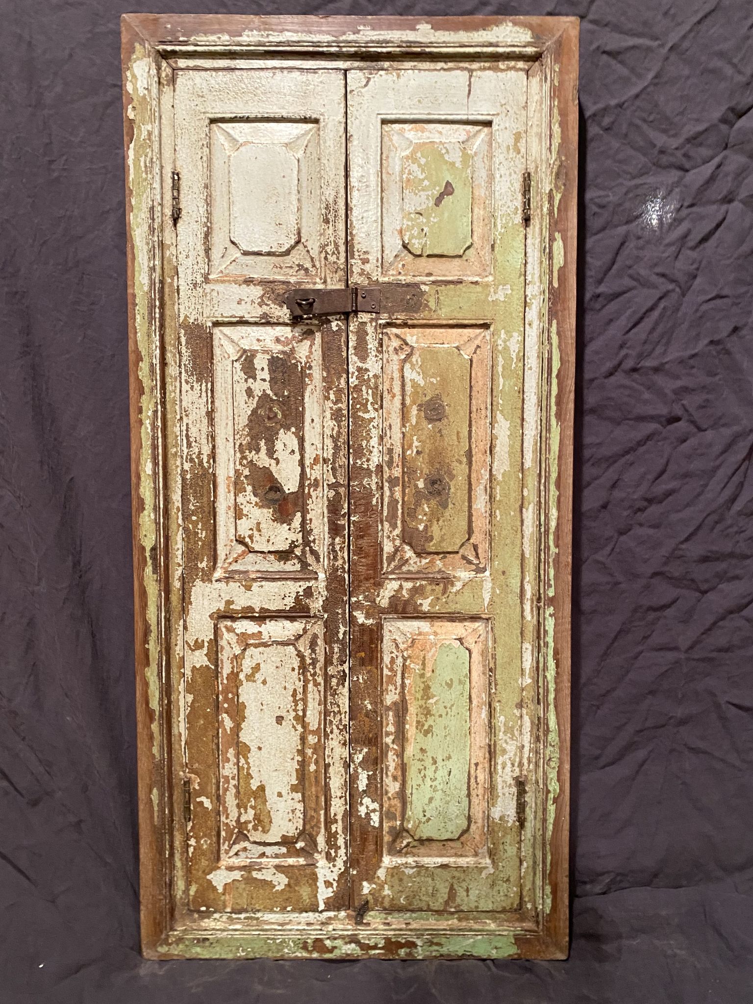 Indian window in green patinated wood