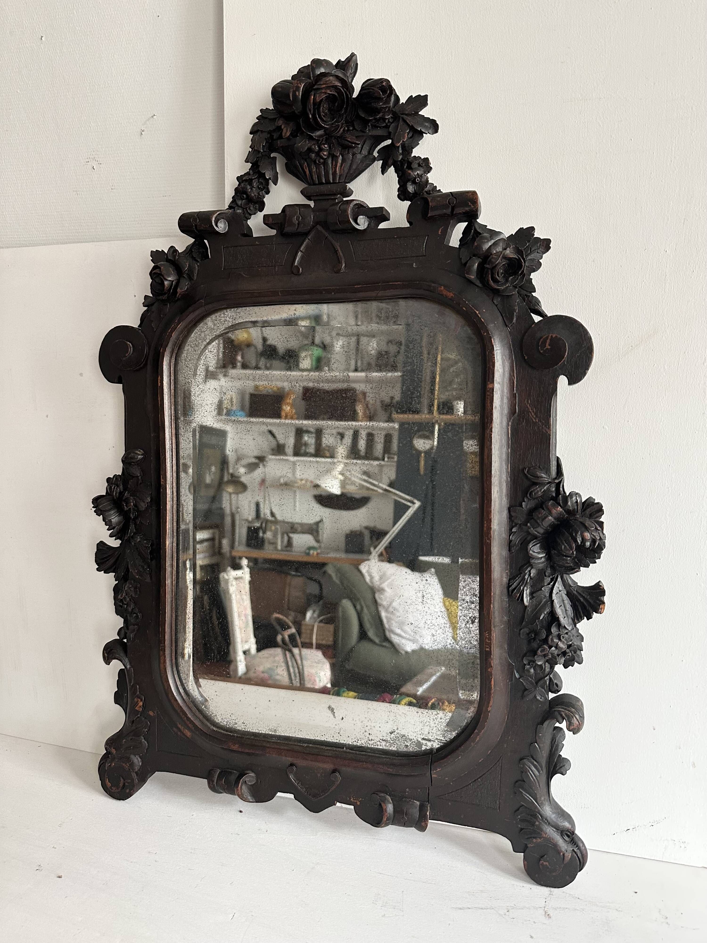 Napoleon III mirror in carved blackened wood, 19th century