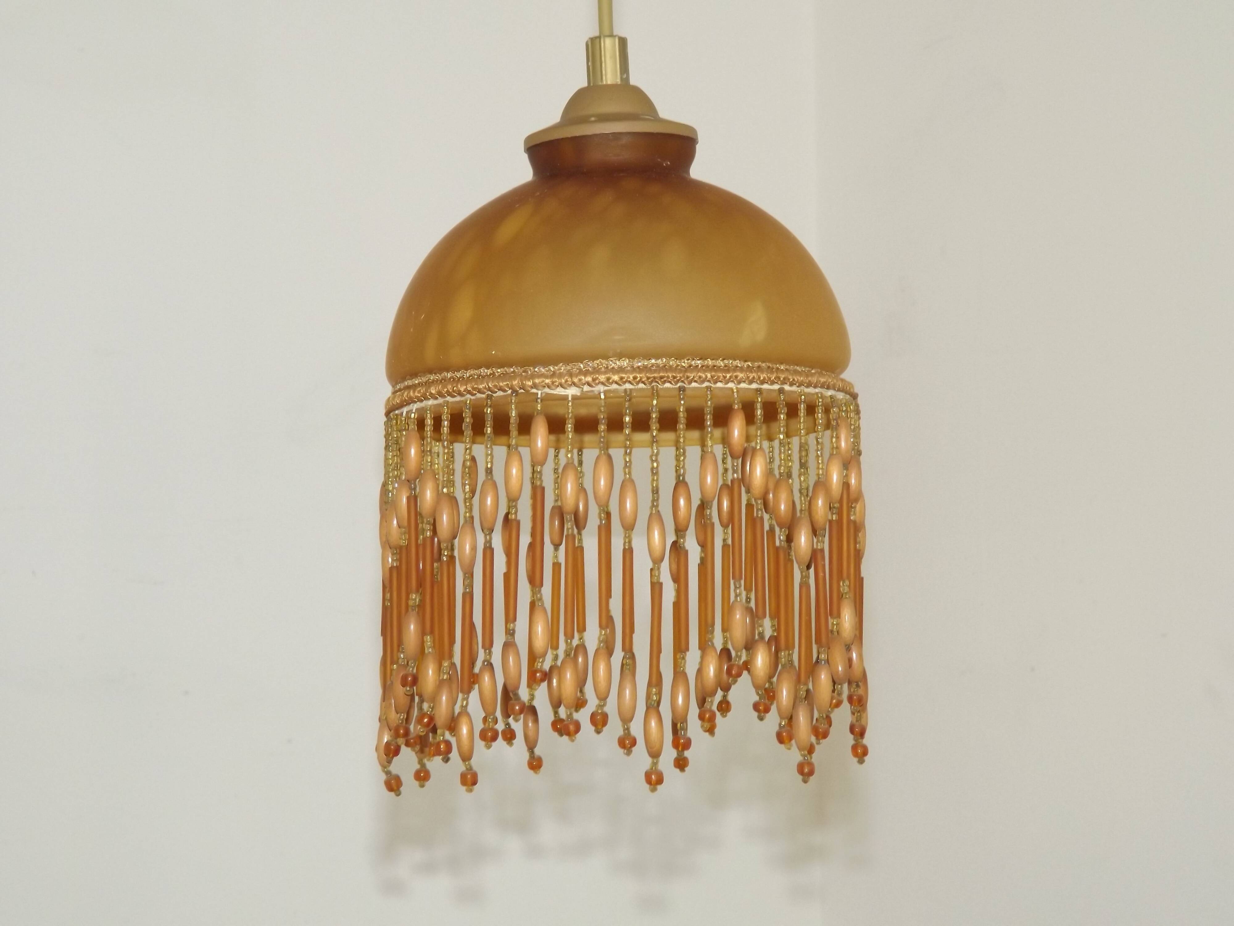 Vintage French amber mottled glass hanging ceiling light with beaded fringe.
