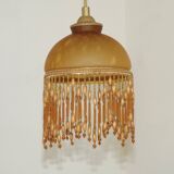 Vintage French amber mottled glass hanging ceiling light with beaded fringe.