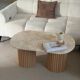 Table basse ovale en travertin et bois cannelé brut
