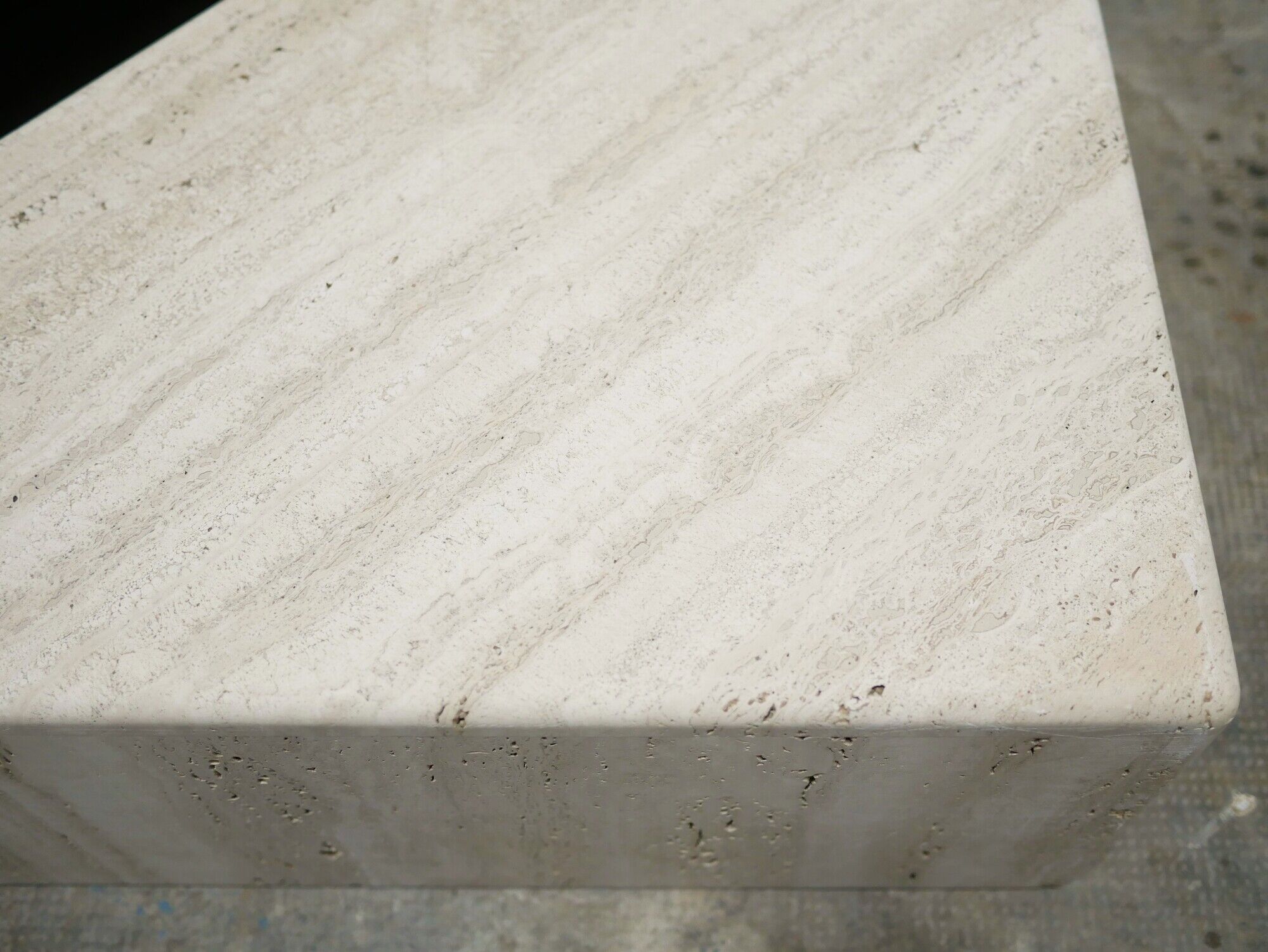 Series of 2 vintage travertine coffee tables published by Roche Bobois