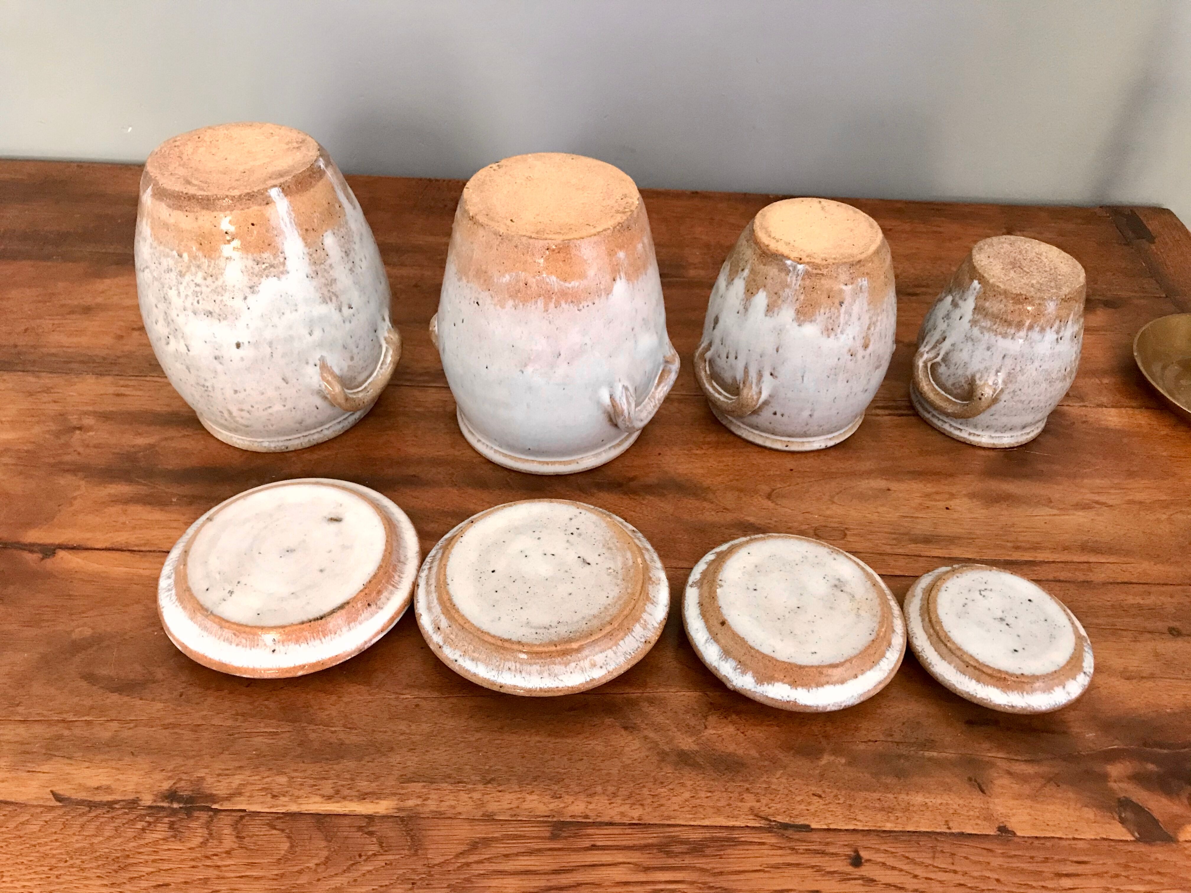 Suite of antique enamelled ceramic pots