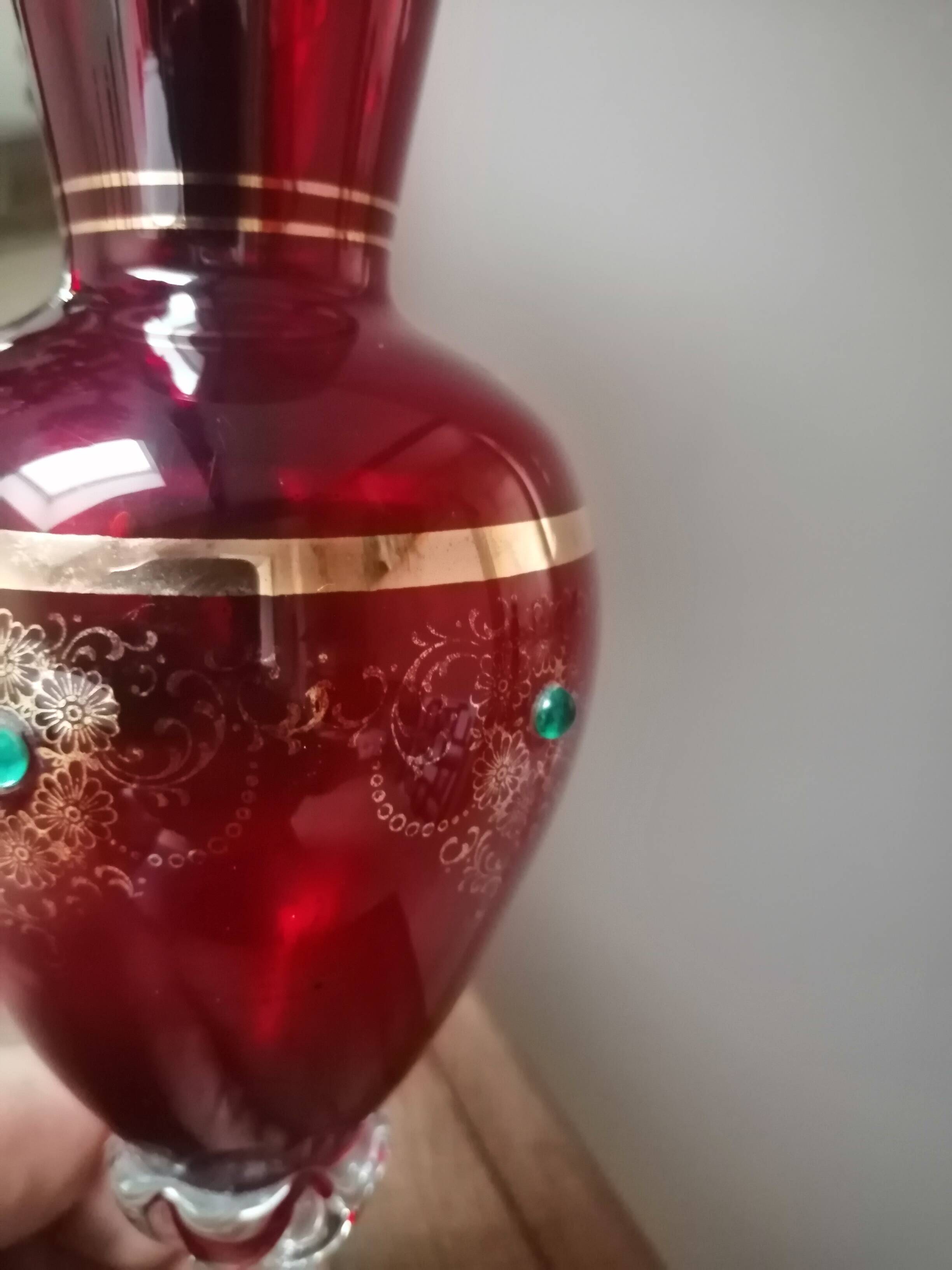 Red vase with gold decoration