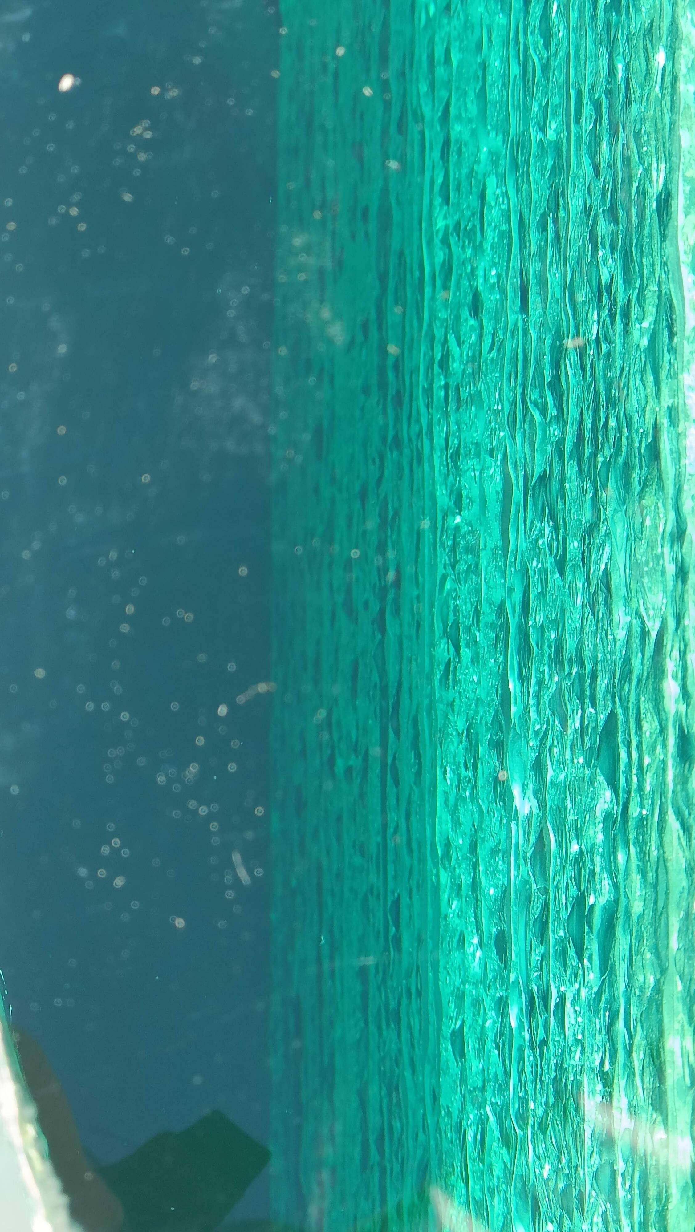 Solid glass desk with a half-moon top.