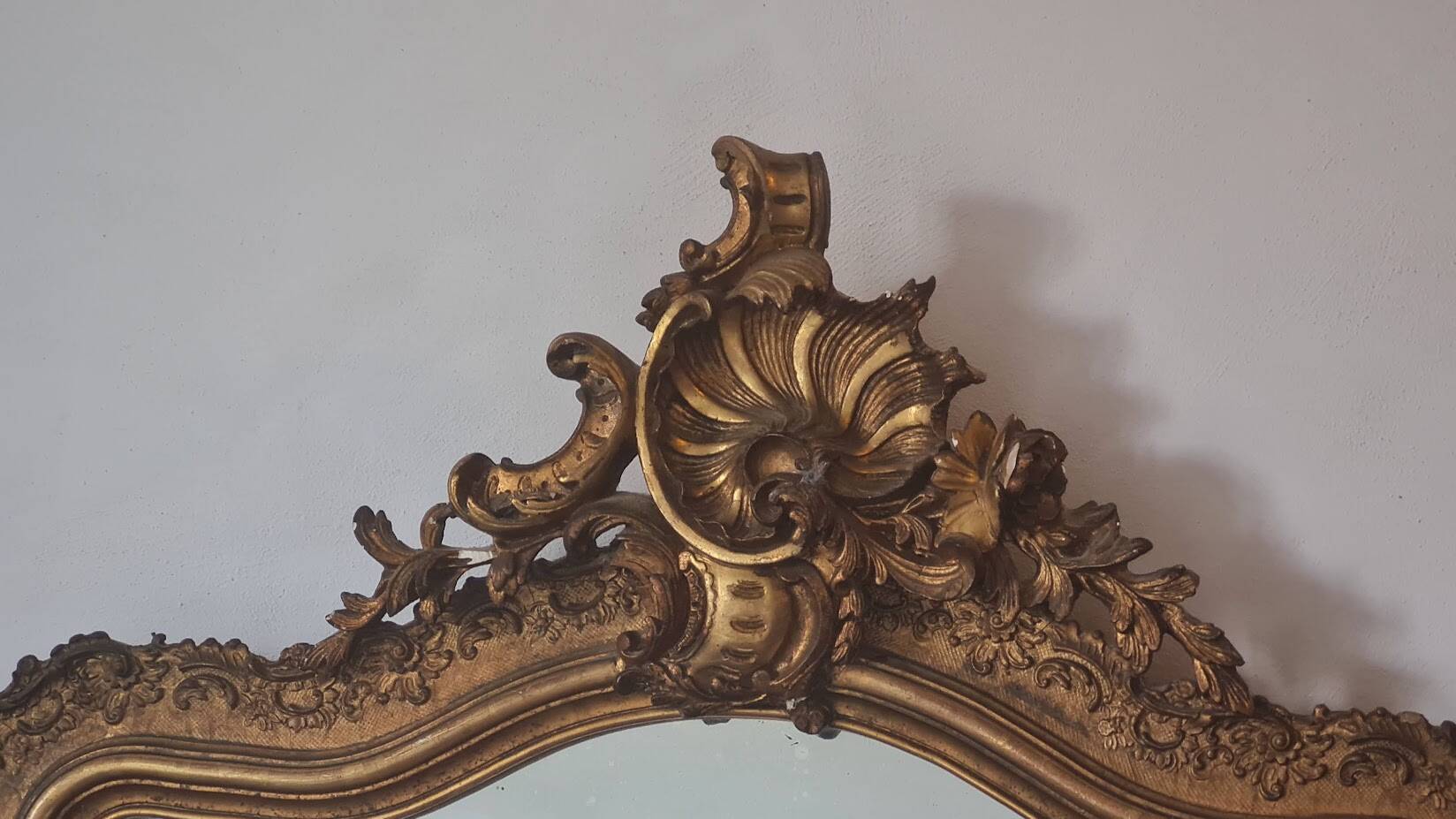Antique Louis Philippe mirror with a pediment.