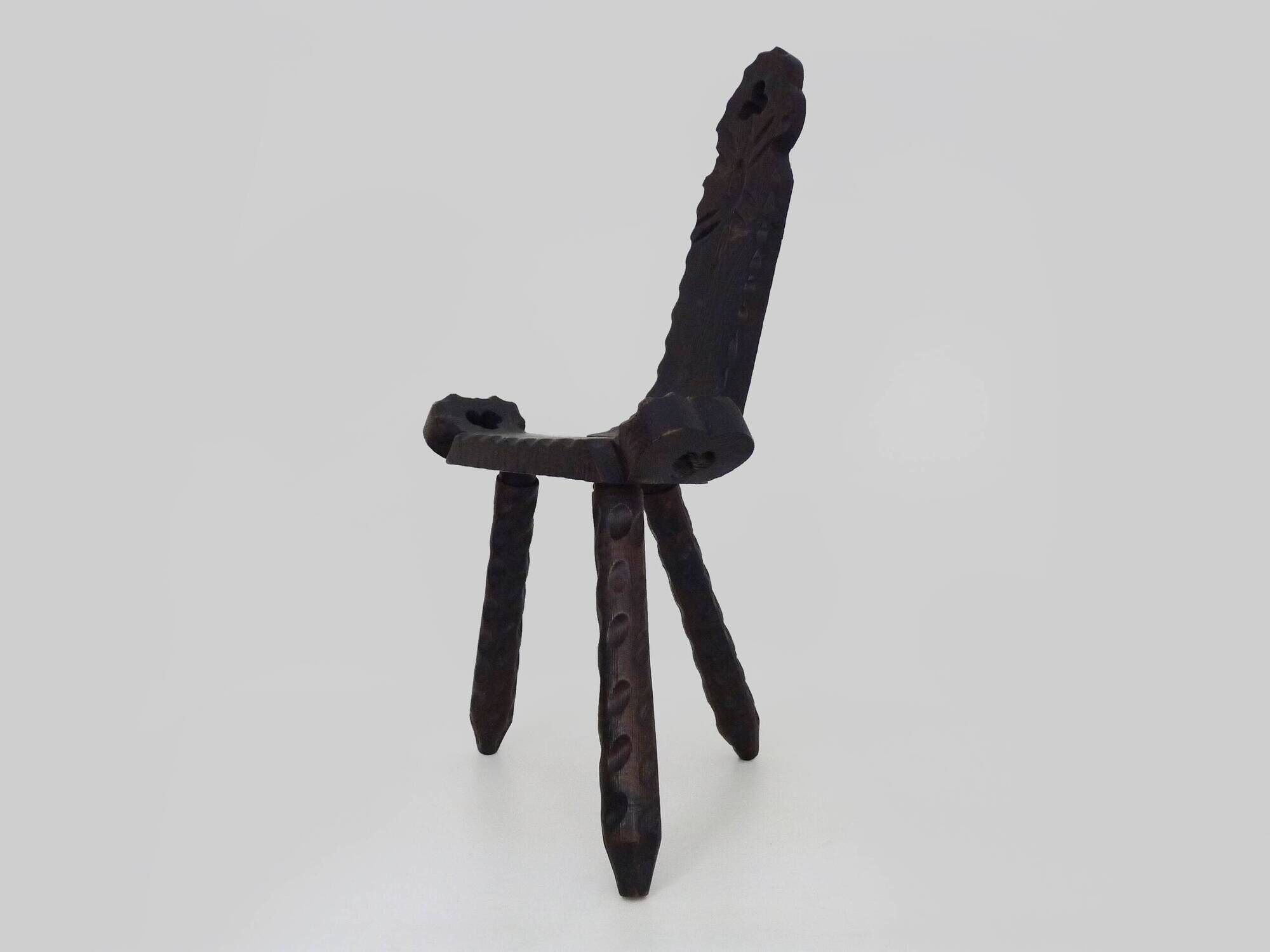 Brutalist tripod chair in raw wood. solid wood chair