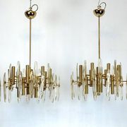 Sciolari, pair of Italian brass and glass chandeliers from 70s