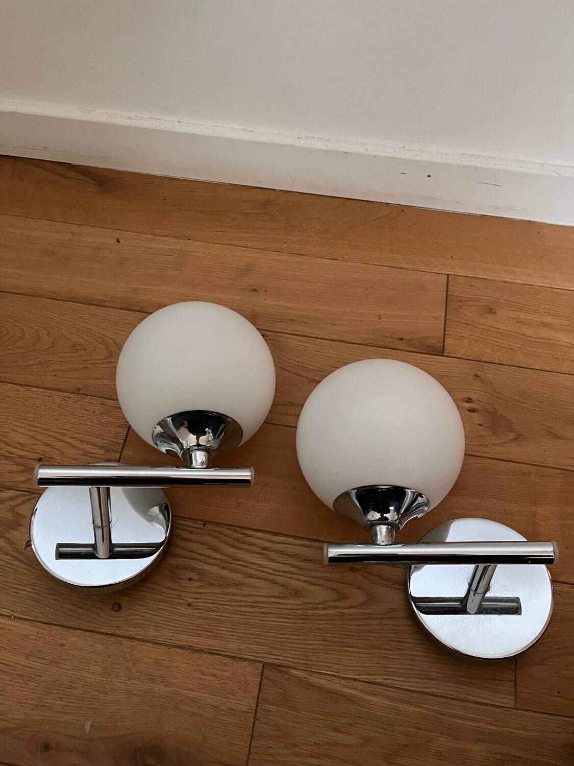 Pair of metal and opaline wall lights