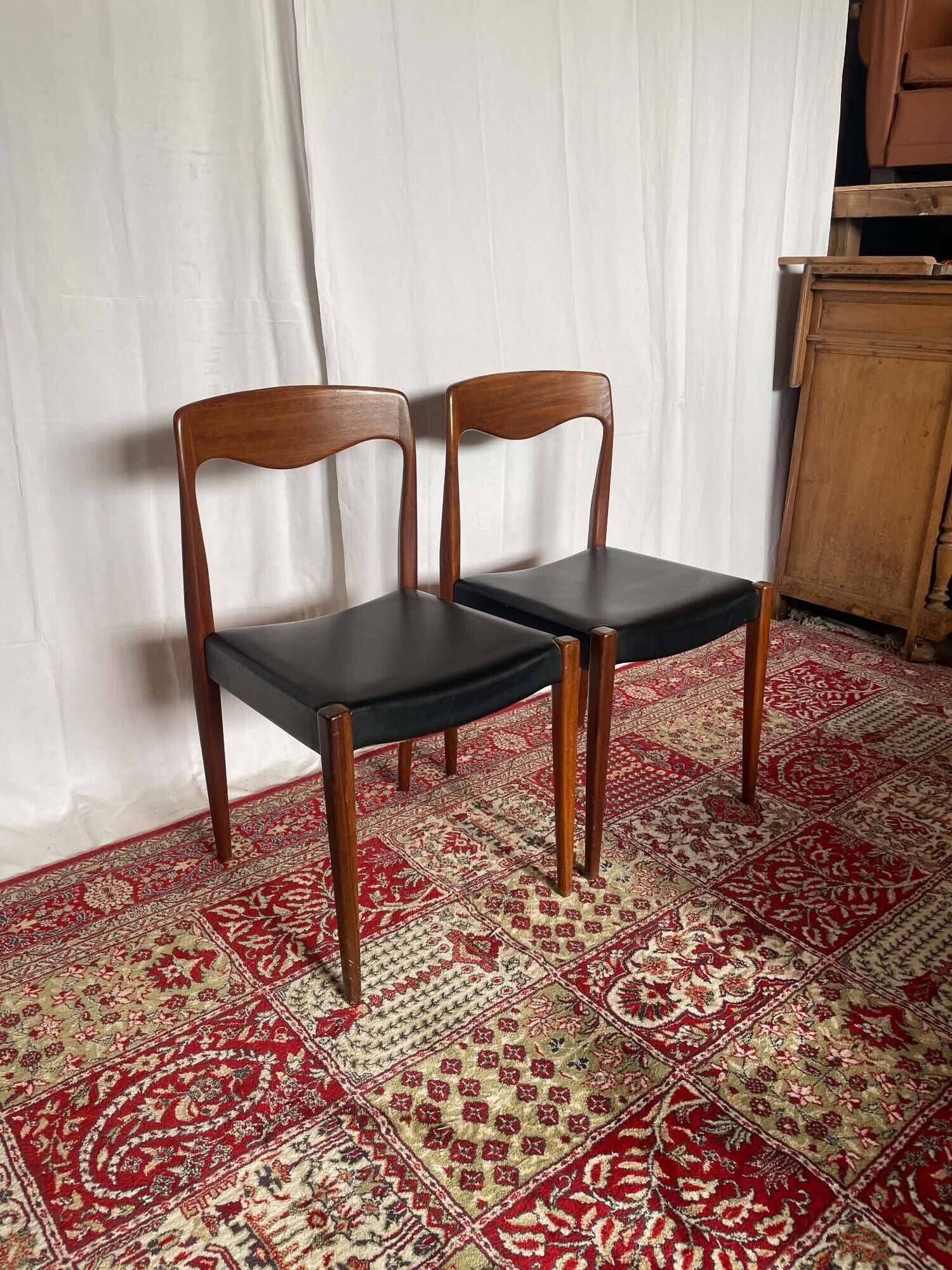 Pair of vintage teak chairs with black faux leather – Scandinavian style
