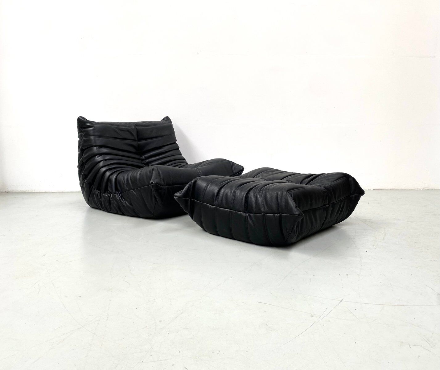 Togo chair and pouffe-black leather attributed to Ducaroy for Ligne Roset.