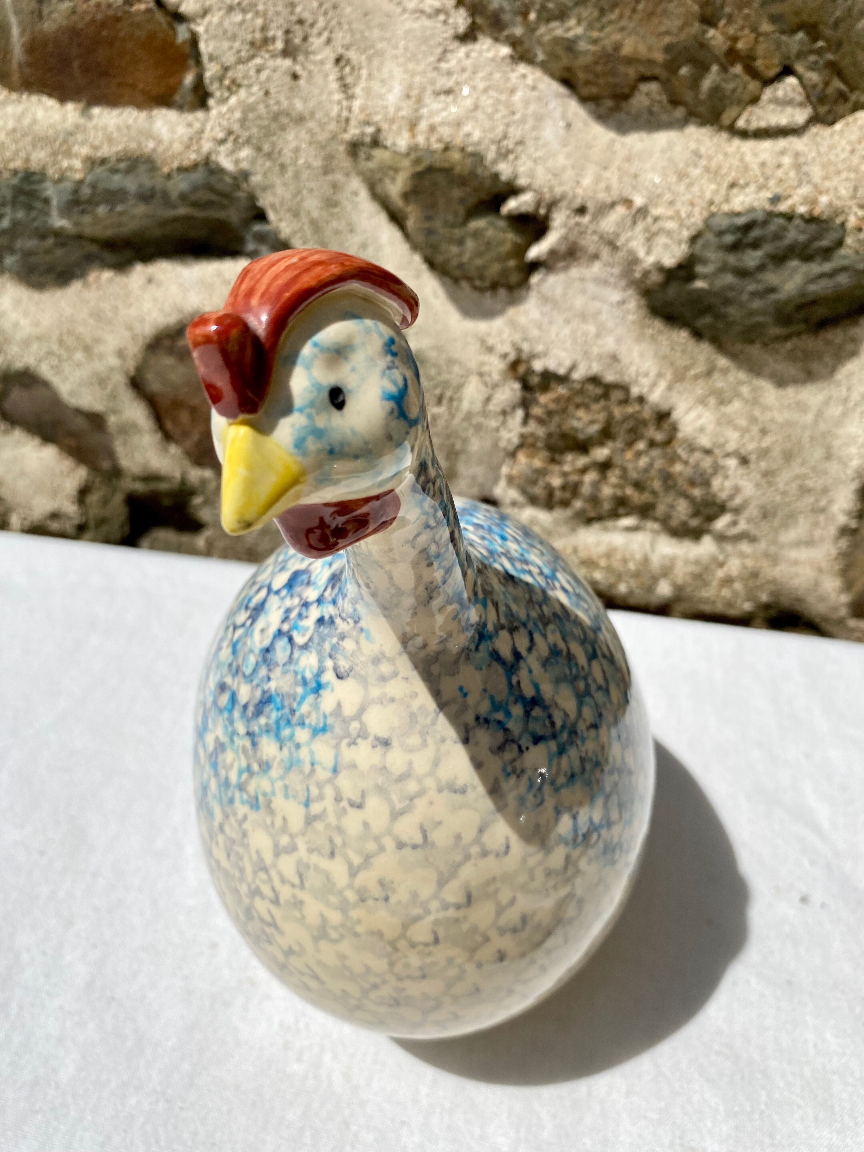 Signed ceramic hen and guinea fowl