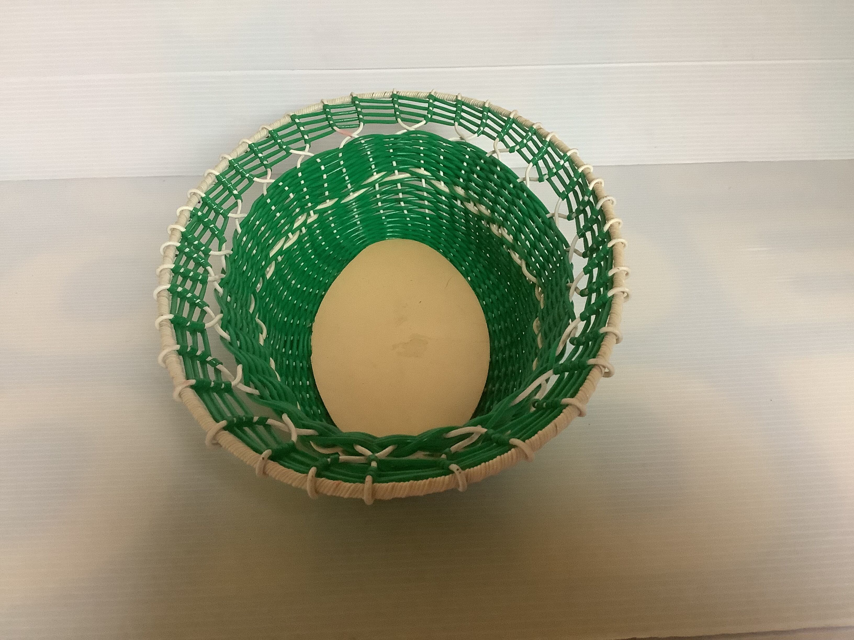 Old green scoubidou basket