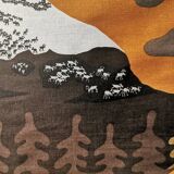 Beautiful wall-mounted Swedish fabric print with motifs of mountains, reindeer and more.