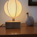 Handmade wooden ball lamp on a stand
