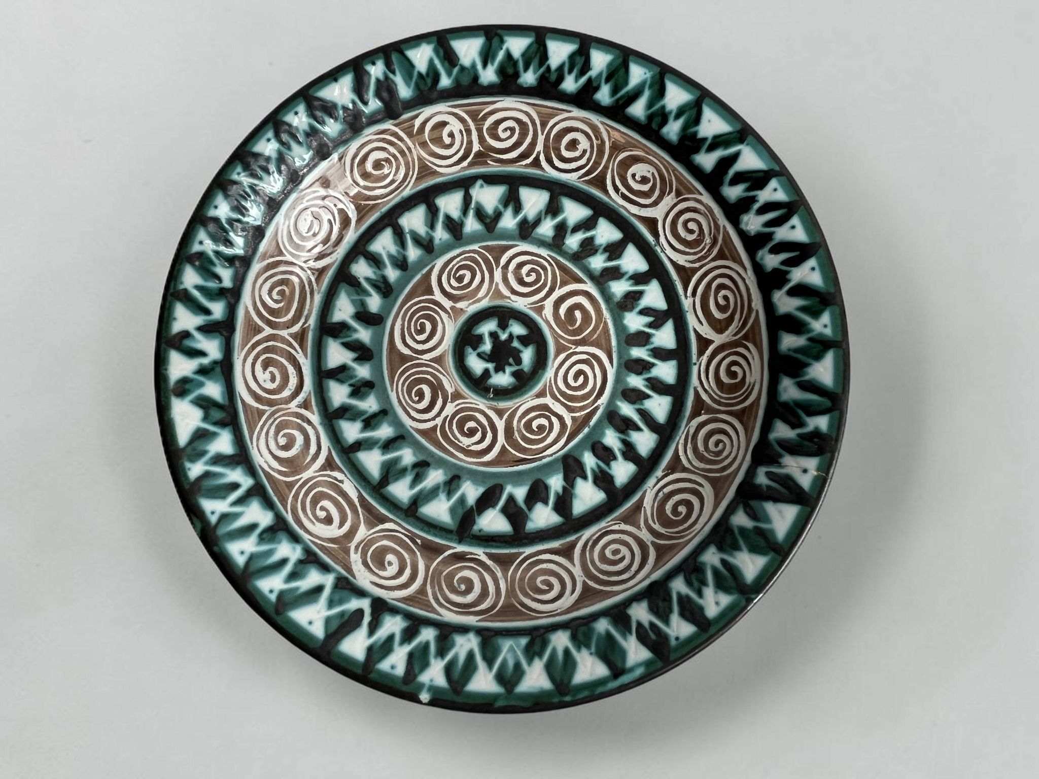 Picault, polychrome earthenware plate with geometric decoration from the 20th century.