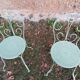 Garden furniture set with 1 table, 2 armchairs, and 2 chairs in antique green wrought iron.