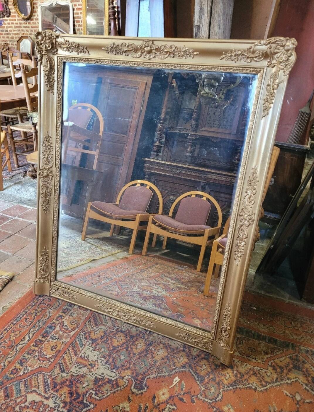 Antique gilded mirror from the 19th century, mercury mirror.