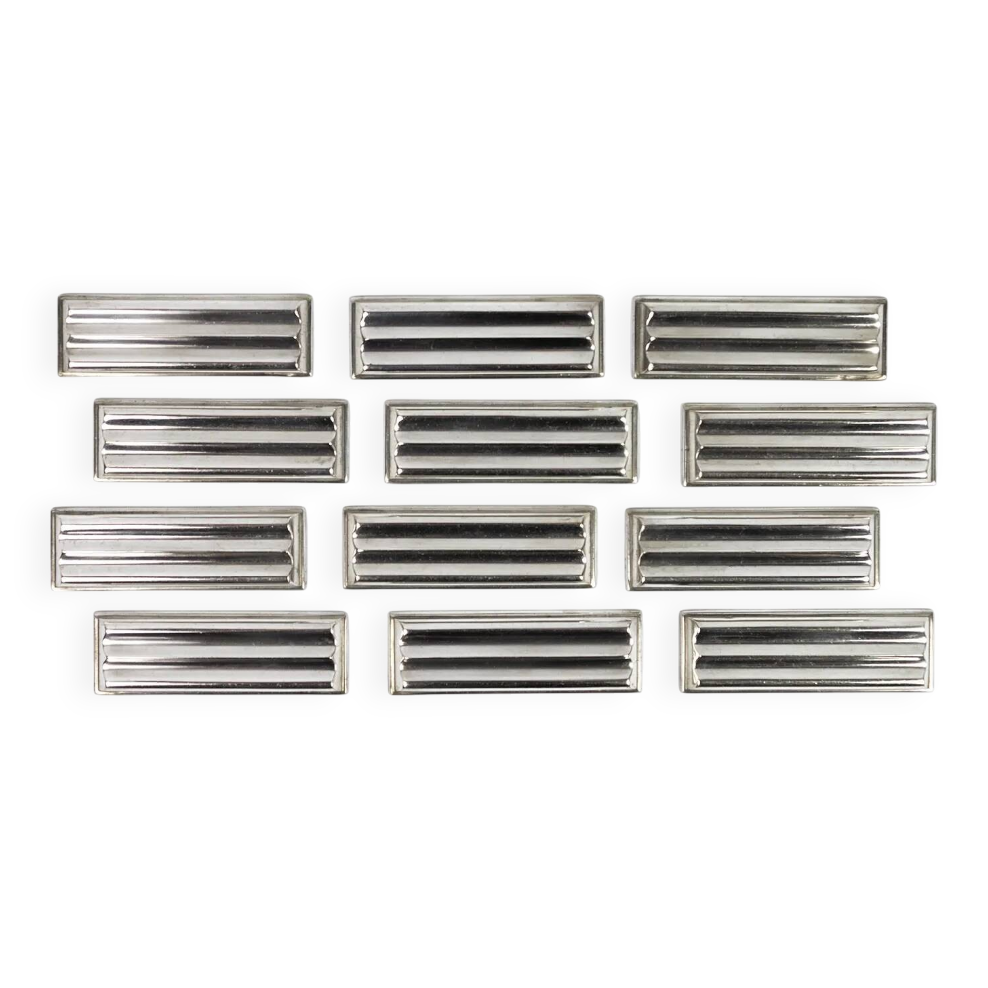 Christofle — 12 “Ondulations” knife rests by Luc Lanel, silver-plated metal