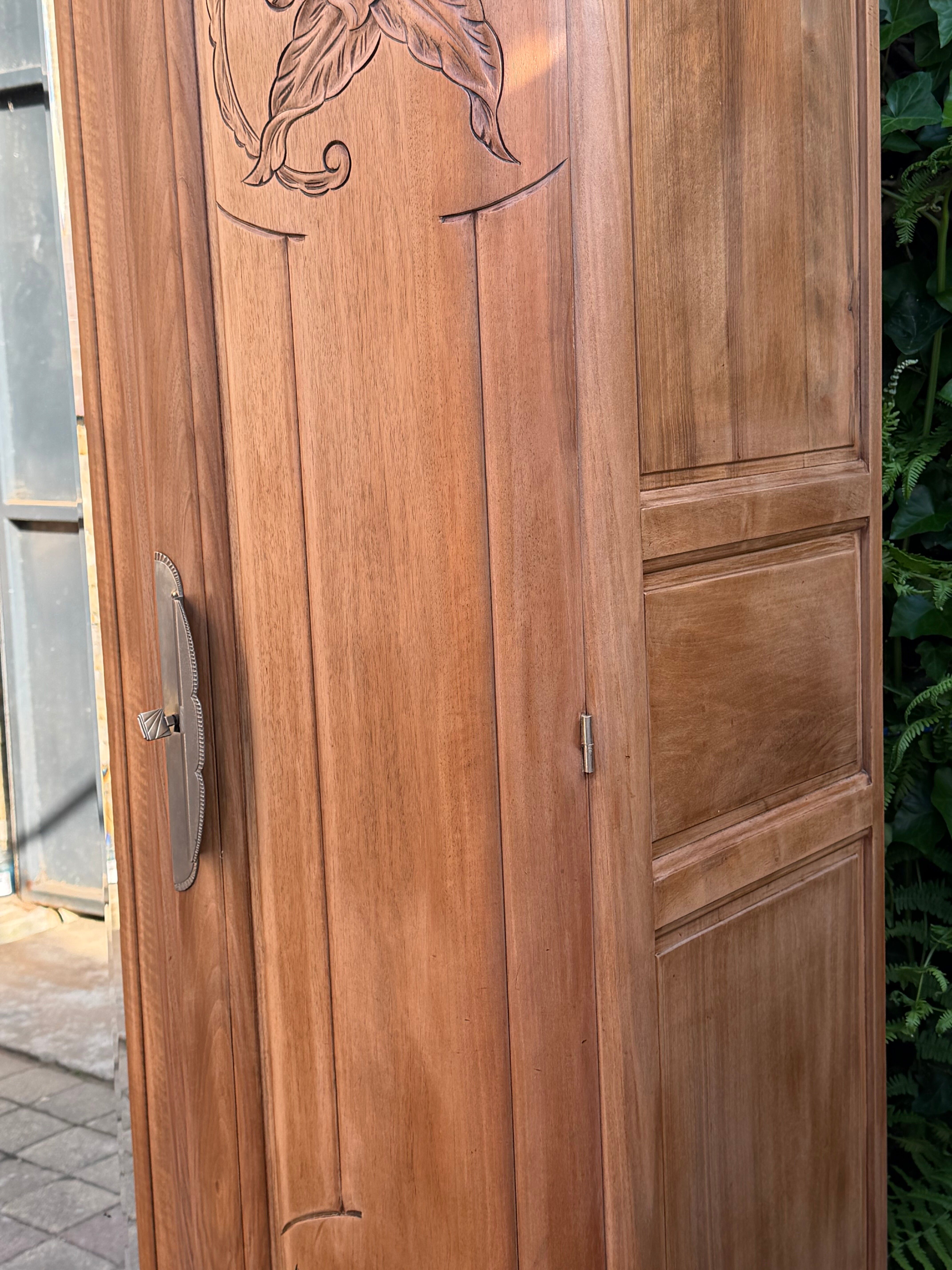 Art Deco wardrobe with bevelled mirror in solid raw walnut.