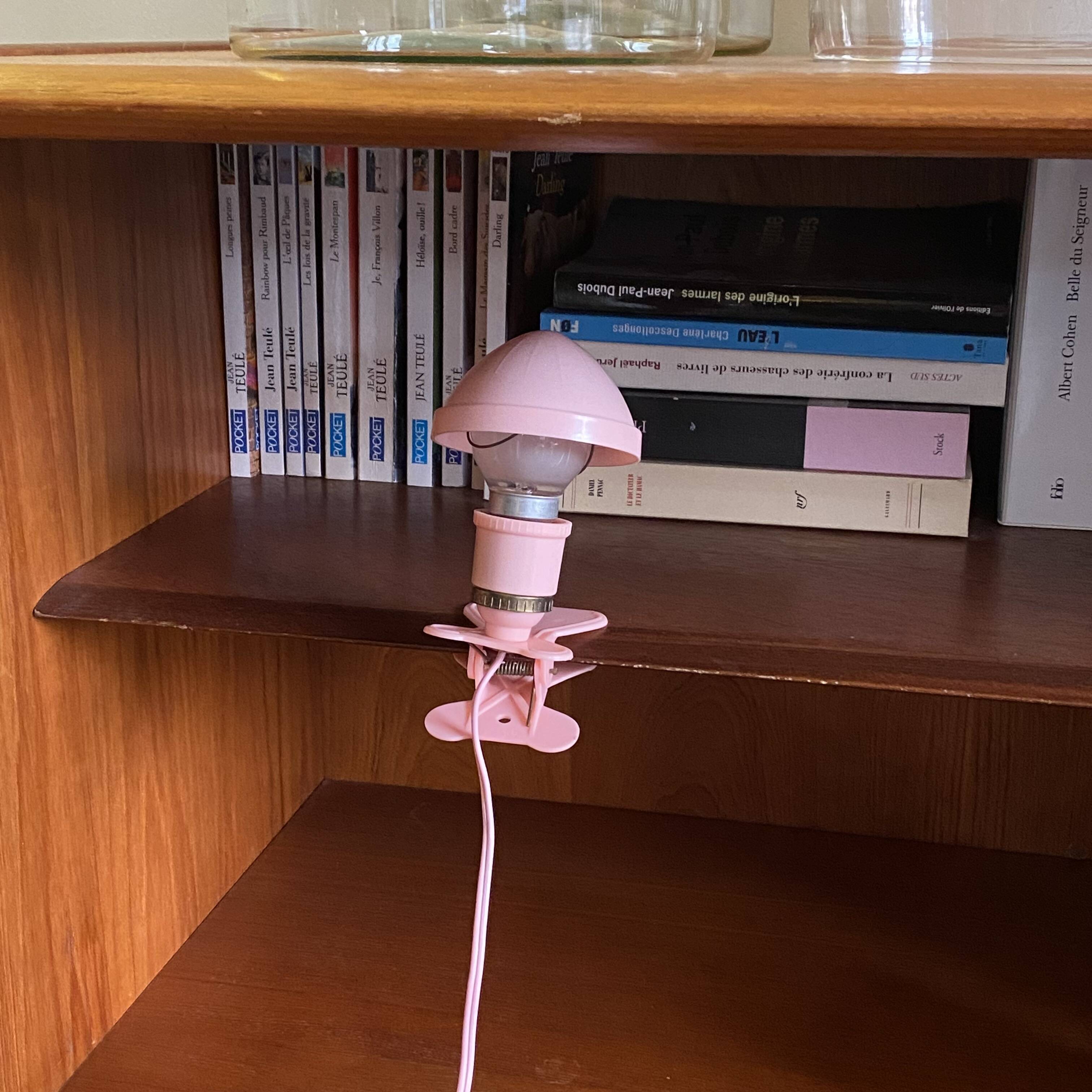 Small portable pink plastic mushroom clip-on lamp