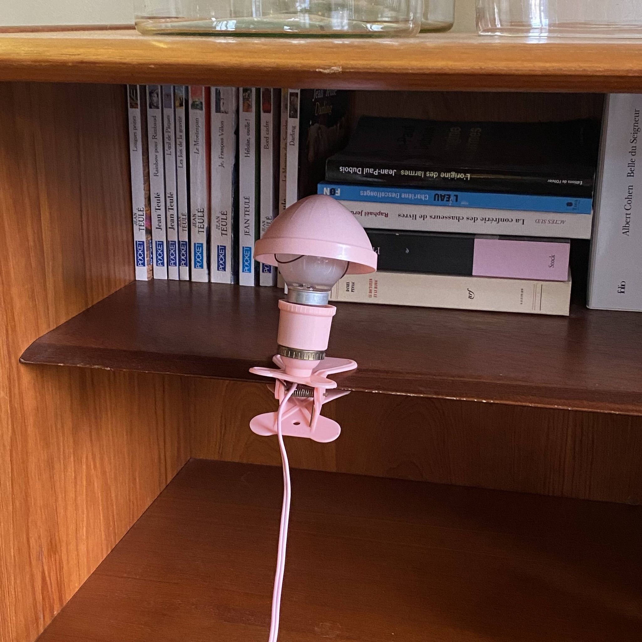 Small portable pink plastic mushroom clip-on lamp