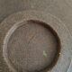 Two terracotta bowls with ethnic decoration and vintage signature.