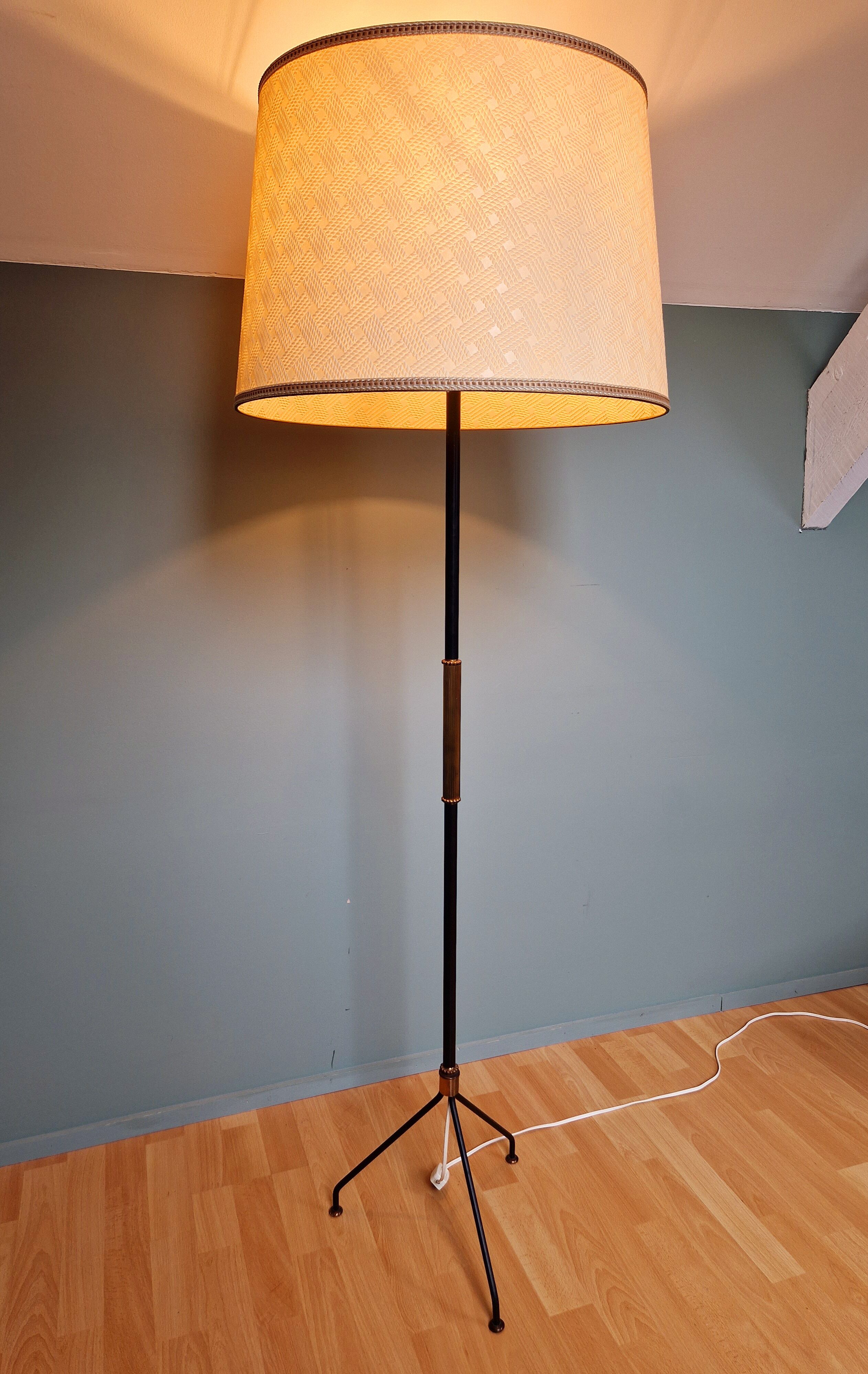 Vintage tripod floor lamp in black lacquered metal and brass, 50s