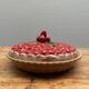 A trompe l’oeil strawberry pie dish