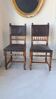 Pair of antique chairs in embossed leather, Henri II style.