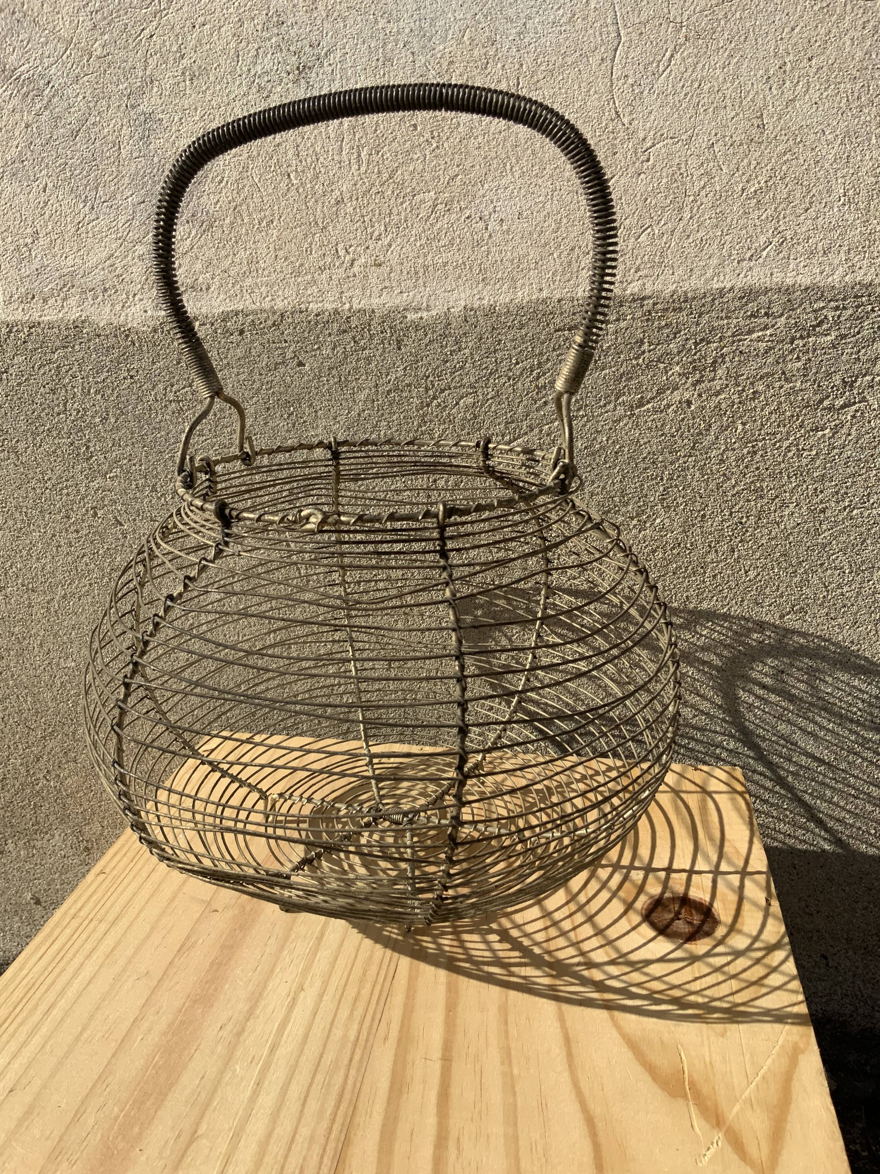 Vintage iron egg basket with hanse antique