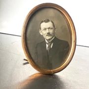 Metal gold colored oval picture frame brass
