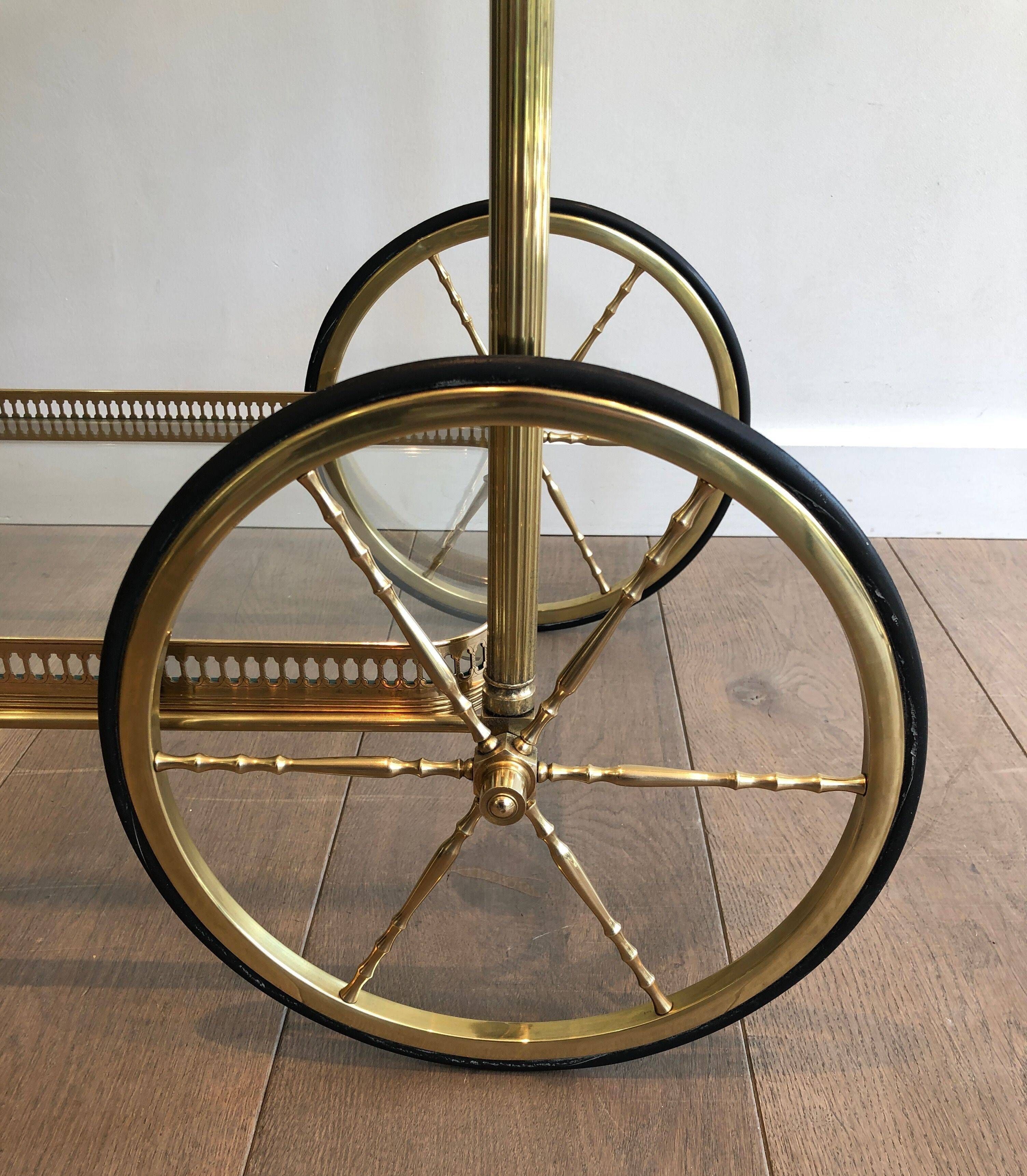 Brass rolling table with removable double trays from Maison Jansen.