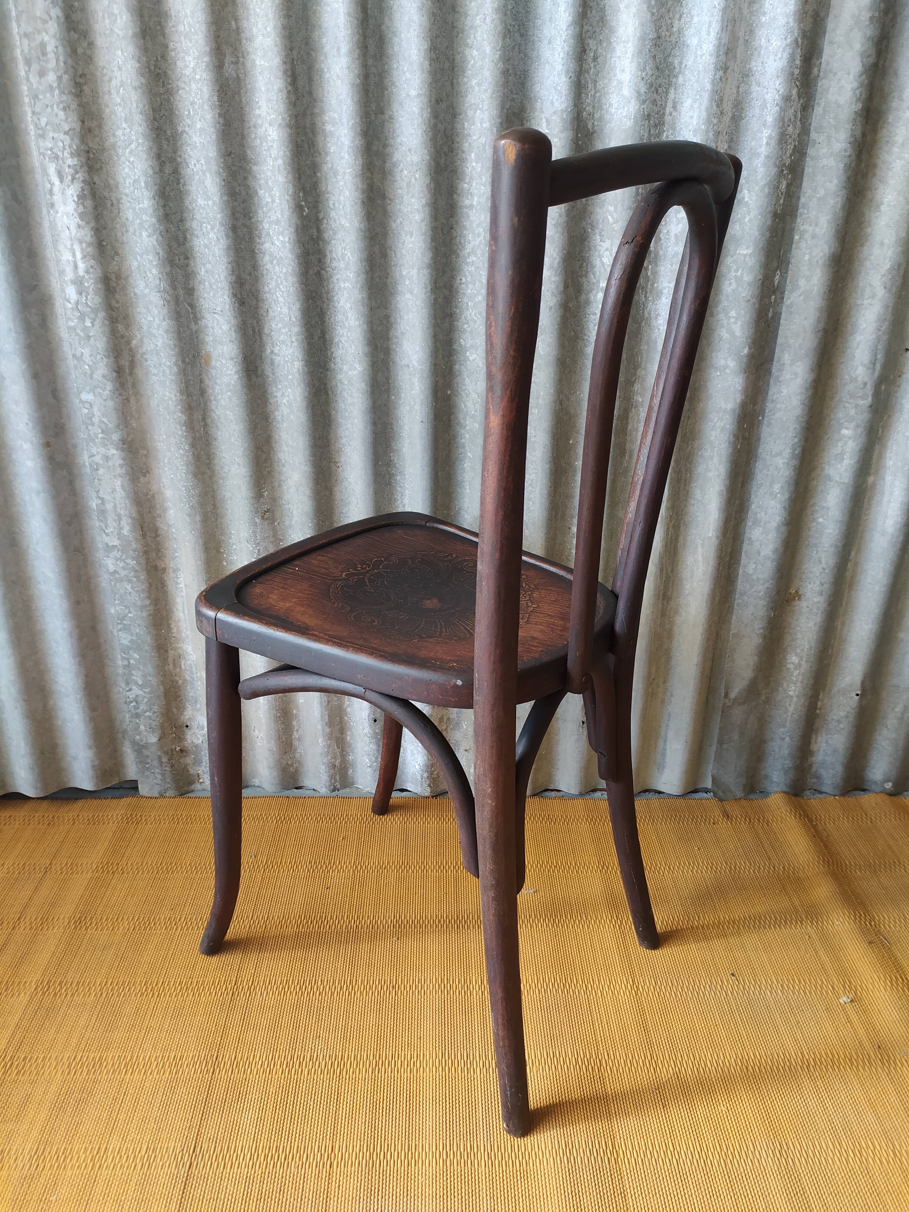 Curved wooden bistro chair