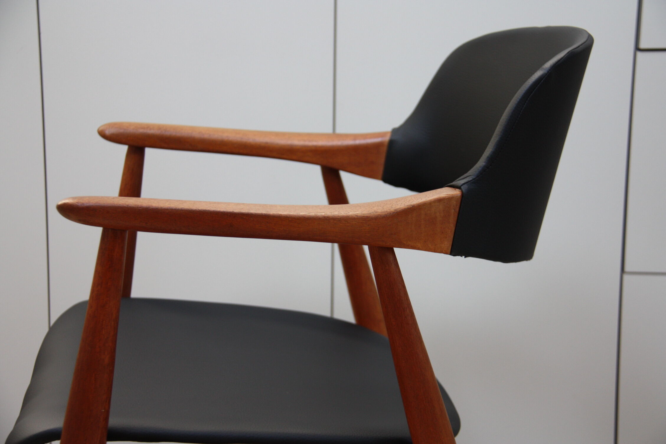 Vintage armchair in teak and black leather model Casina 60s