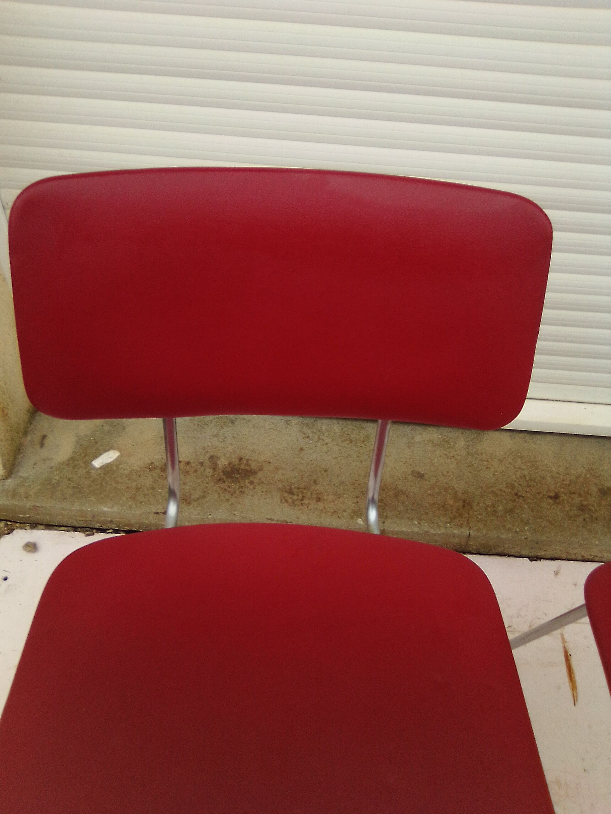 2 chairs in red skaï metal struxture 70s