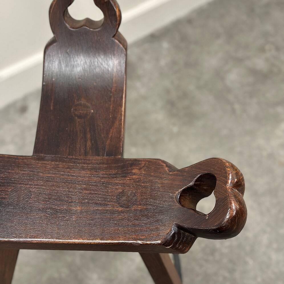 Set of 3 rustic carved oak bar stools with iron footrests, 1970s