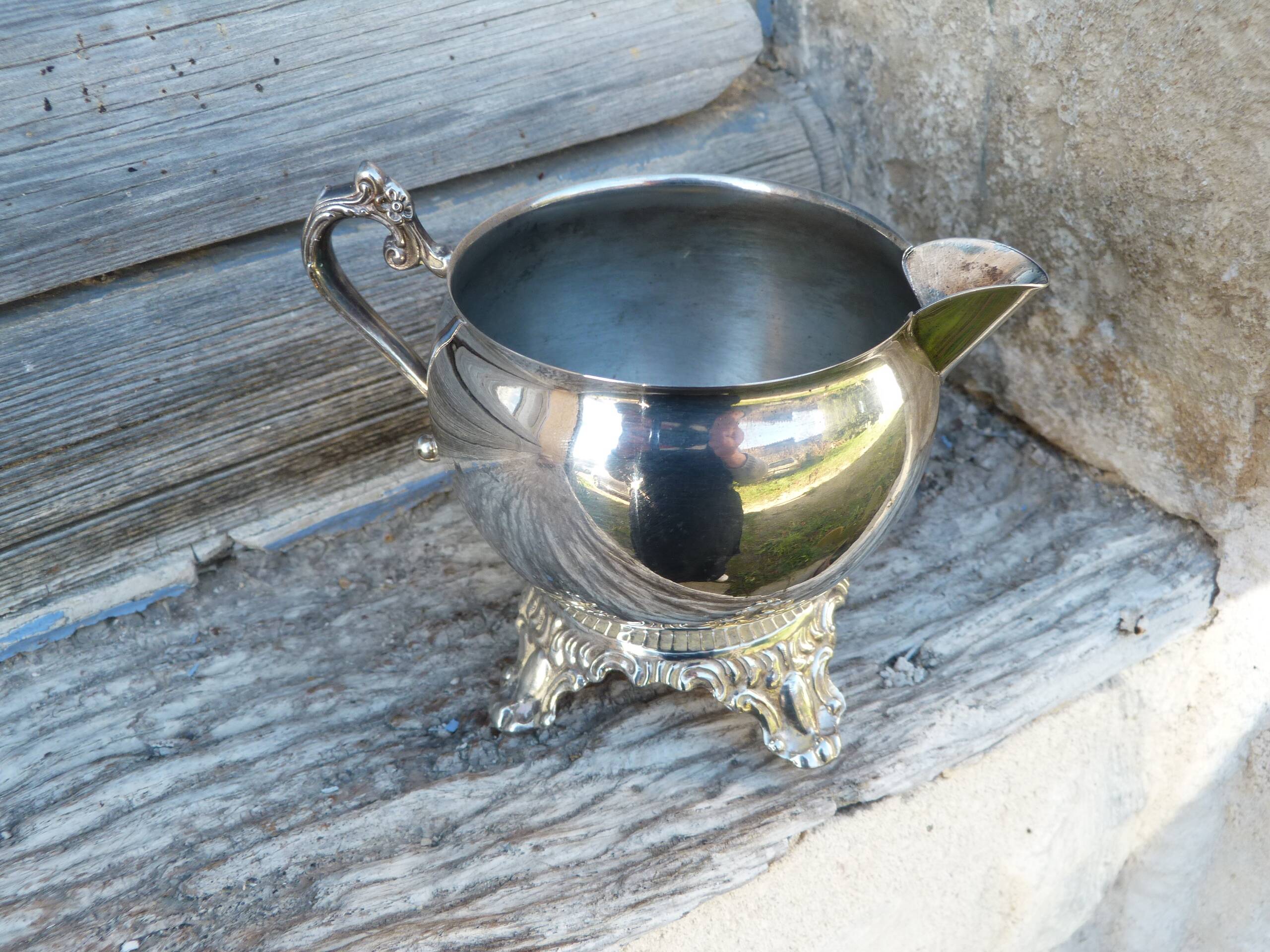 Old silver-plated metal milk or cream jug