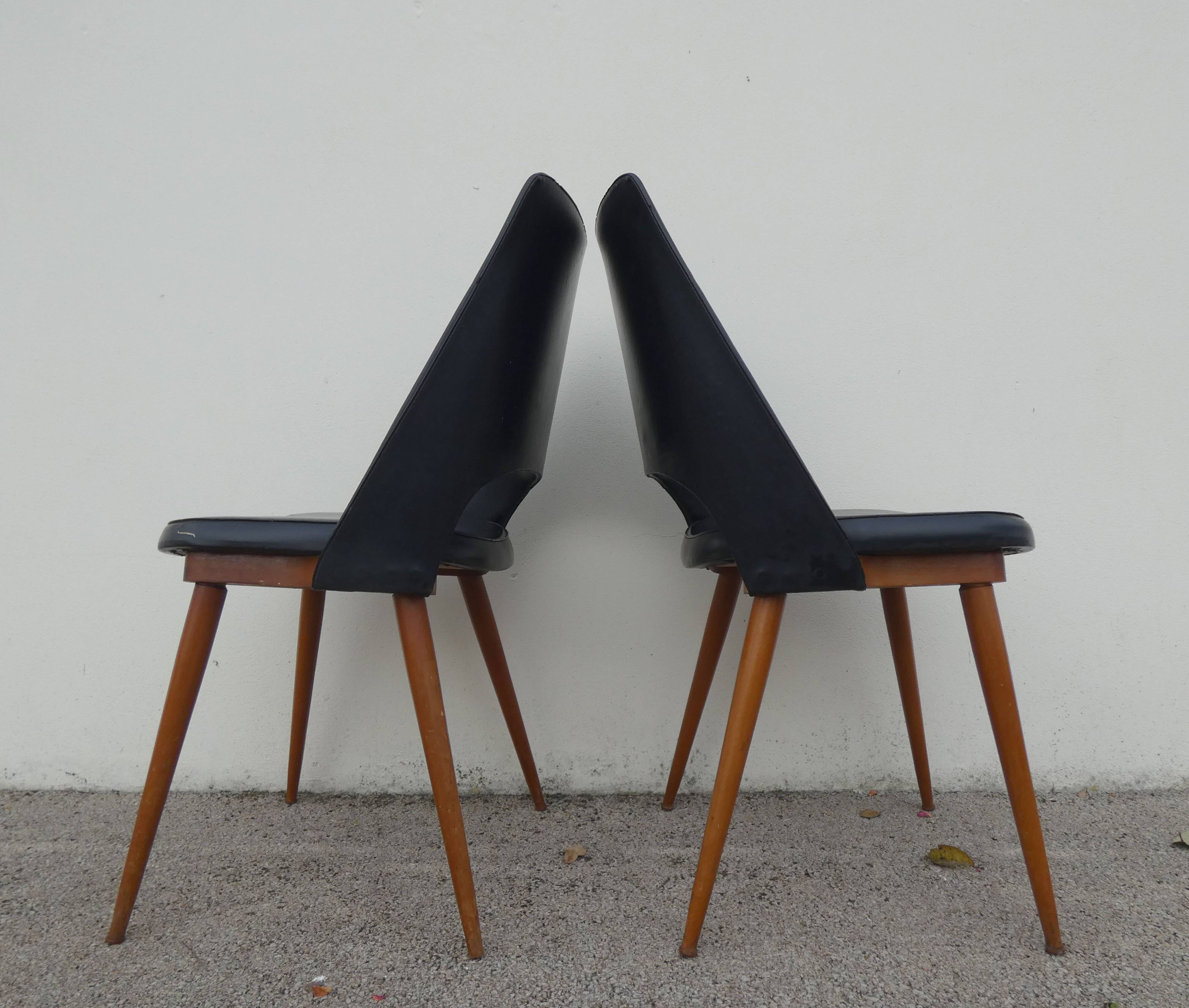 2 chairs in black skai compass legs Louis Paolozzi