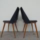 2 chairs in black skai compass legs Louis Paolozzi