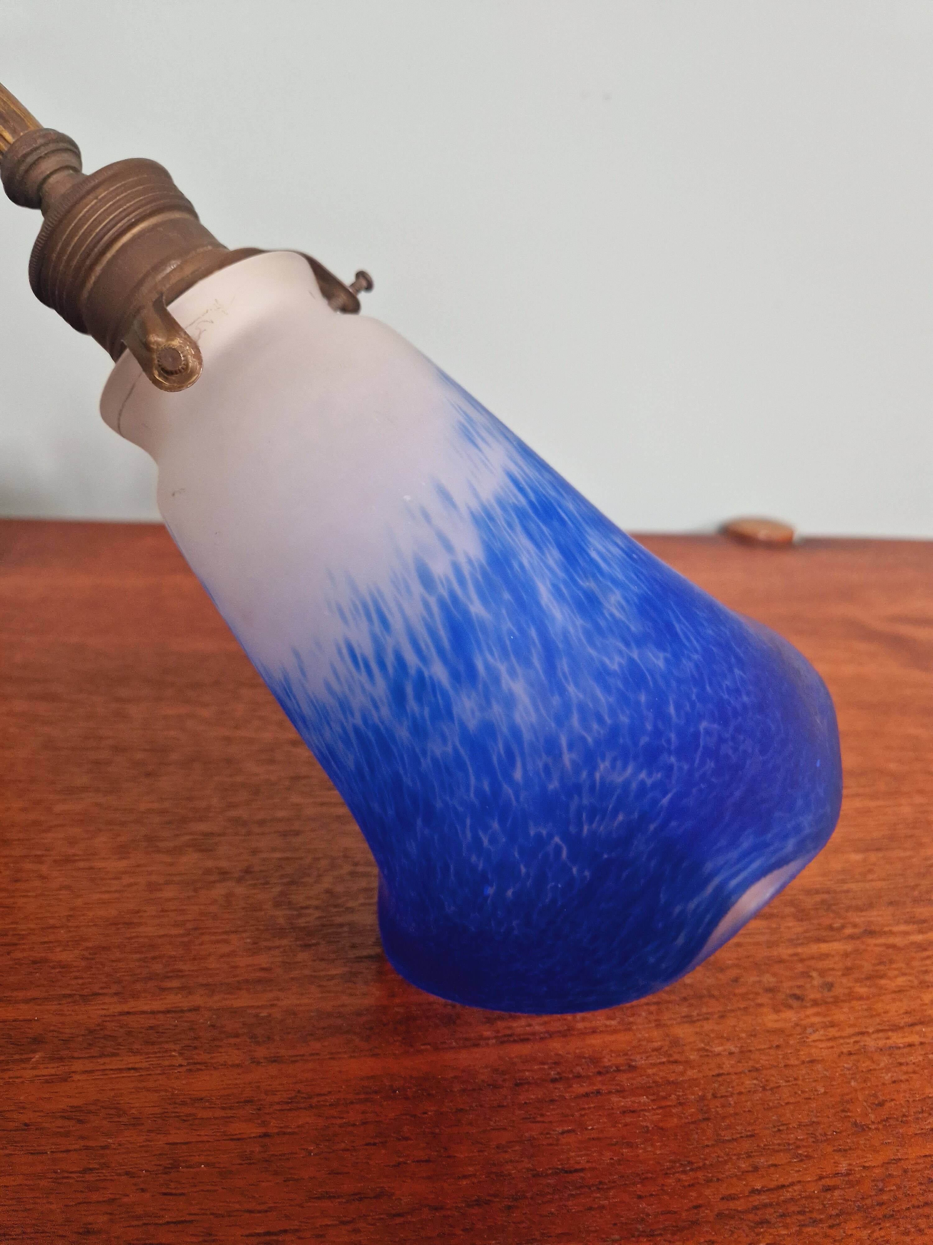 Wall light in gilded bronze and blue marmoreal glass, early 20th century