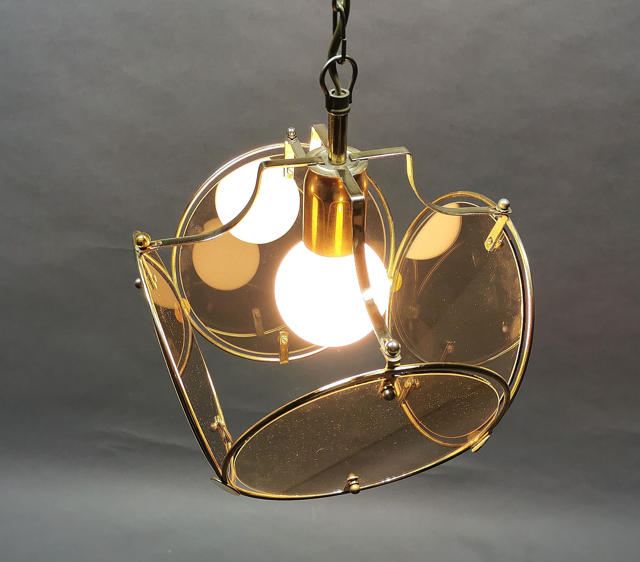 Suspension from the 70s in brass and brown smoked glass