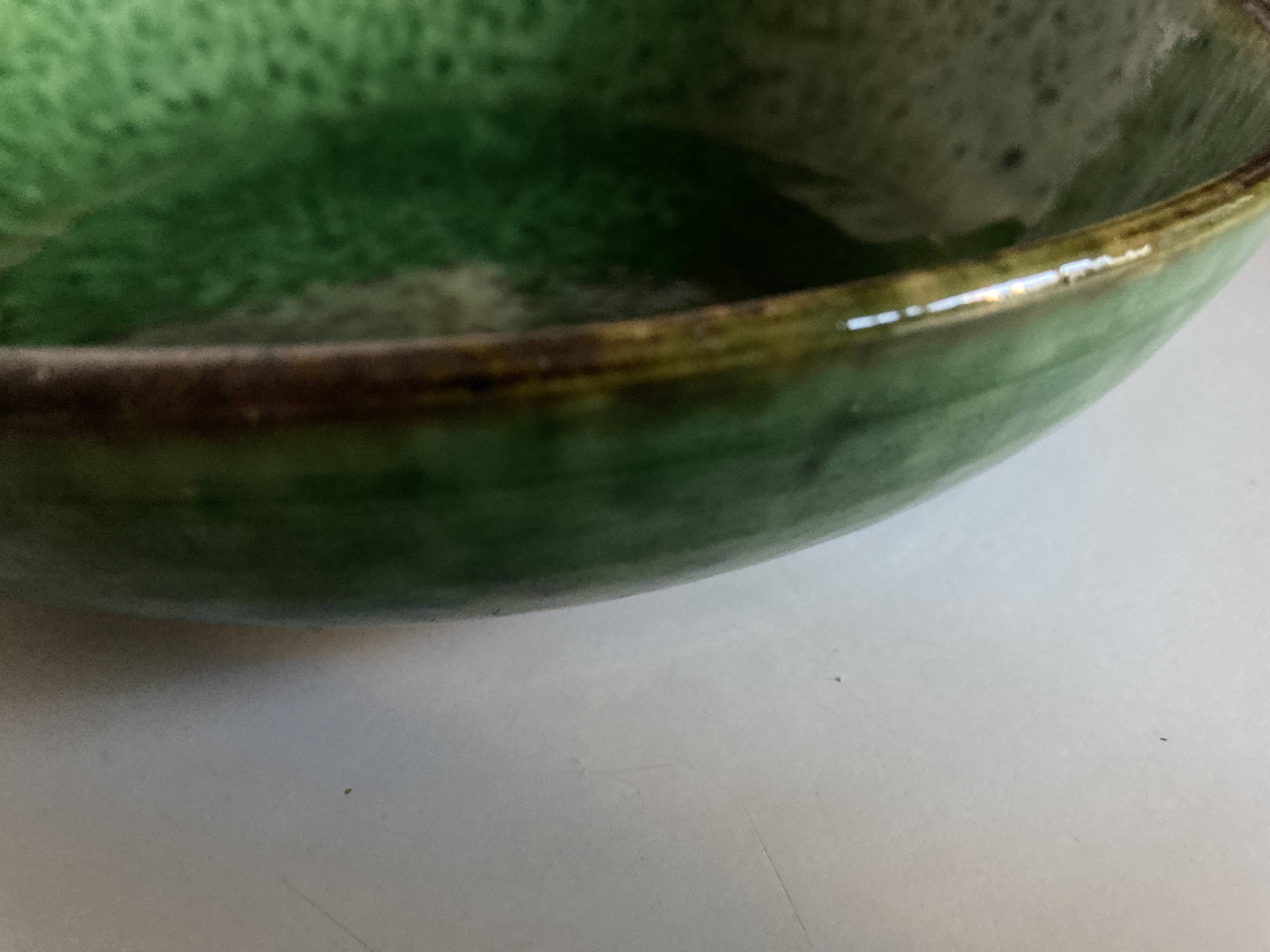 Aegitna hollow dish on heel in green glazed earthenware