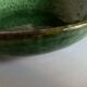 Shallow dish Aegitna on a green glazed earthenware base