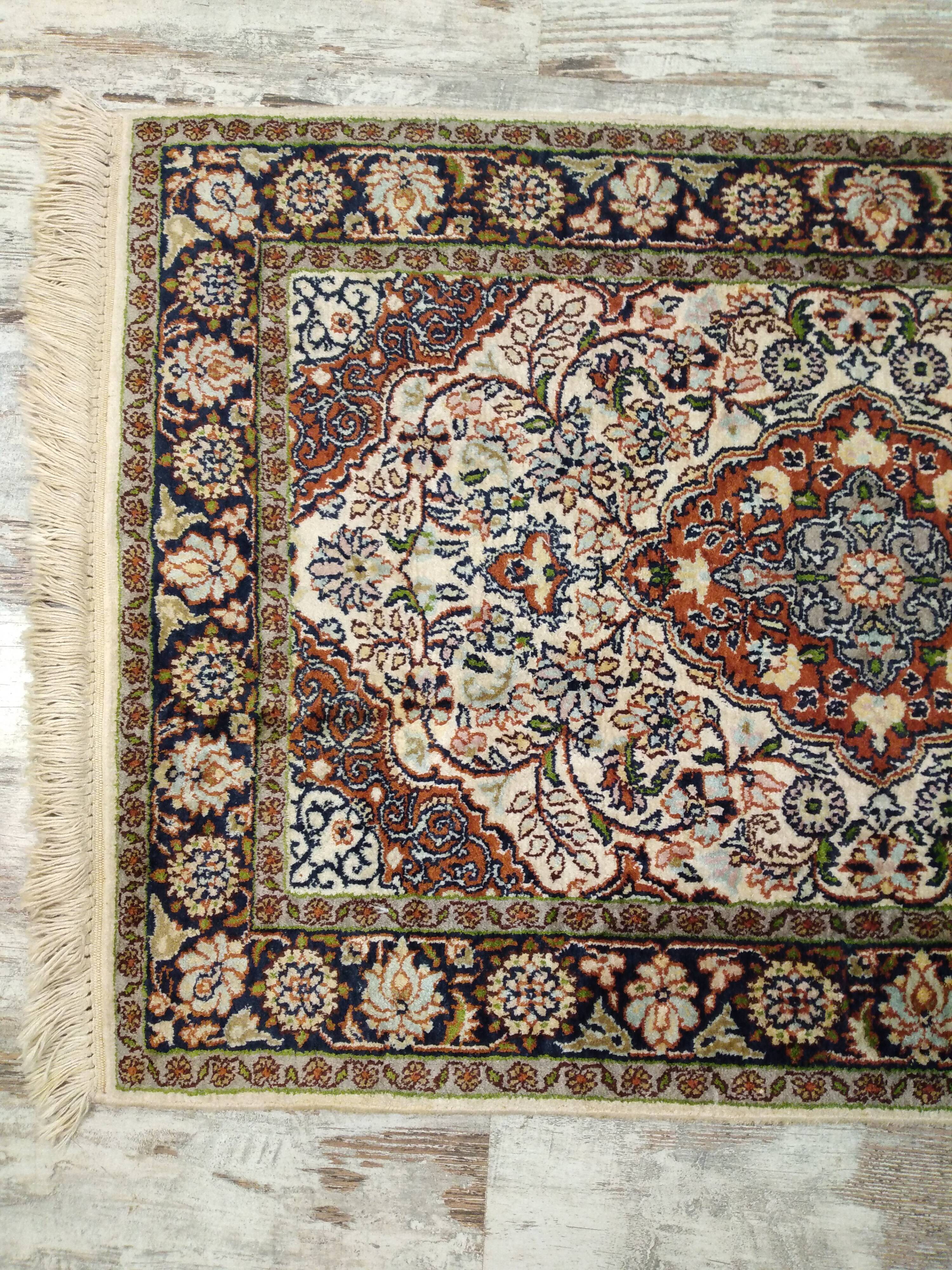 Handmade Persian wool and silk rug
