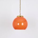 Orange glass pendant light by Peill Putzler, Germany, 1970.